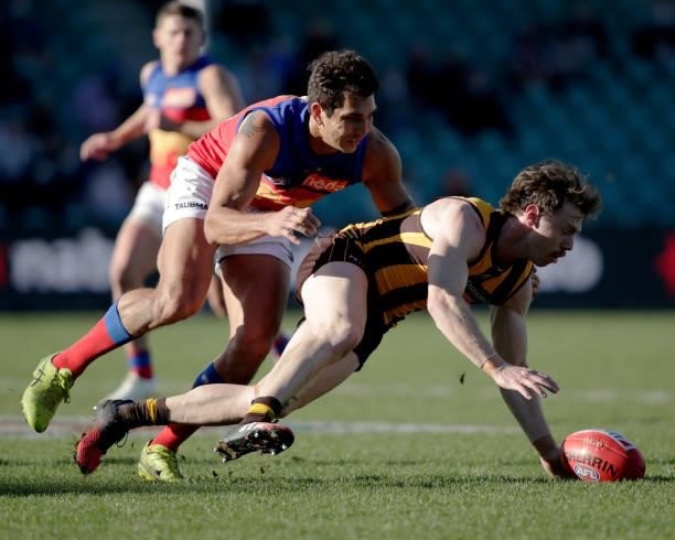 Lachlan Bramble of the Hawks and Nakia Cockatoo of the Lions during the 2021 AFL Round 20 match between the Hawthorn Hawks and the Brisbane Lions at...