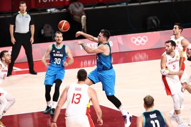 Luka Doncic of the Slovenia Men's National Team drives to the basket and passes the ball against the Spain Men's National Team during the 2020 Tokyo...