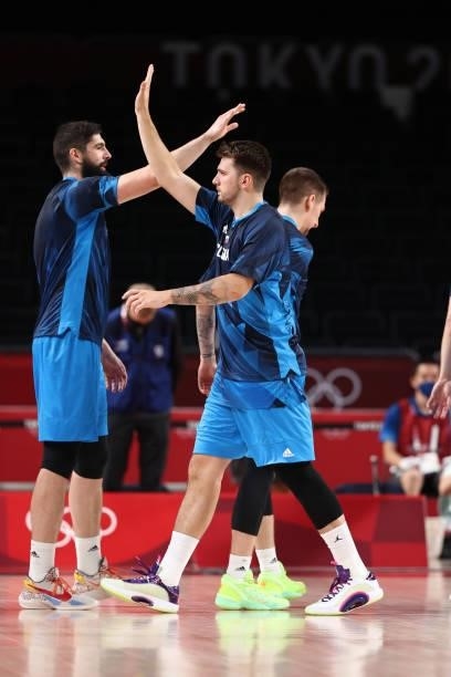 Luka Doncic of the Slovenia Men's National Team high fives teammates before the game against the Spain Men's National Team during the 2020 Tokyo...