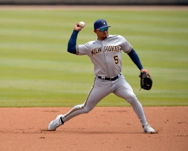 Eduardo Escobar of the Milwaukee Brewers fields a ground ball in the first inning against the Atlanta Braves at Truist Park on August 1, 2021 in...