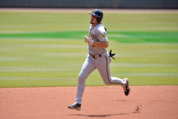 Willy Adames of the Milwaukee Brewers runs to third base after hitting a home run in the first inning against the Atlanta Braves at Truist Park on...