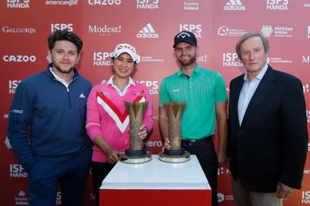Pajaree Anannarukarn of Thailand and Daniel Gavins of England pose with their trophies during the final round of the ISPS HANDA World Invitational at...