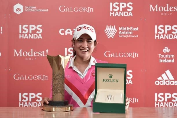 Pajaree Anannarukarn of Thailand poses with the trophy and a Rolex watch after her victory on the second playoff hole during the final round of the...