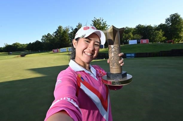 Parjaree Anannarukarn of Thailand imitates taking a selfie with the ISPS HANDA trophy during Day Four of The ISPS HANDA World Invitational at Galgorm...