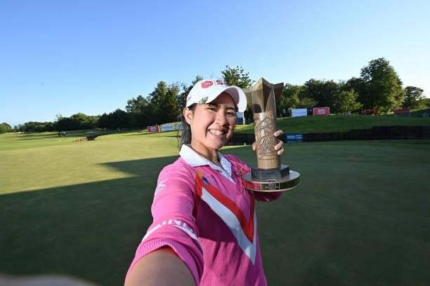 Parjaree Anannarukarn of Thailand imitates taking a selfie with the ISPS HANDA trophy during Day Four of The ISPS HANDA World Invitational at Galgorm...