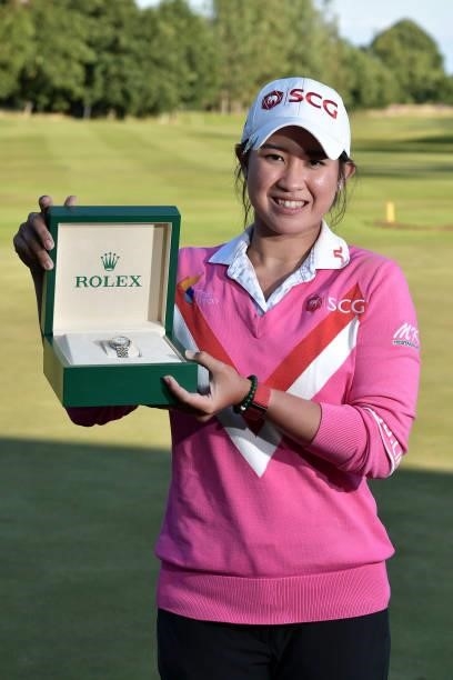 Pajaree Anannarukarn of Thailand poses with a Rolex watch after her victory on the second playoff hole during the final round of the ISPS HANDA World...