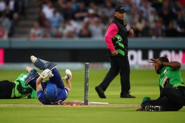 Eoin Morgan of the London Spirit is run out by Chris Jordan of the Southern Brave during The Hundred match between London Spirit Men and Southern...