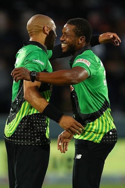 Chris Jordan and Tymal Mills of the Southern Brave celebrate their team's victory during The Hundred match between London Spirit Men and Southern...