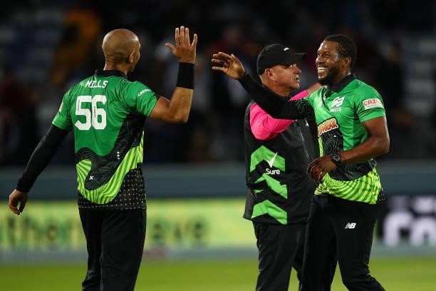 Chris Jordan and Tymal Mills of the Southern Brave celebrate their team's victory during The Hundred match between London Spirit Men and Southern...