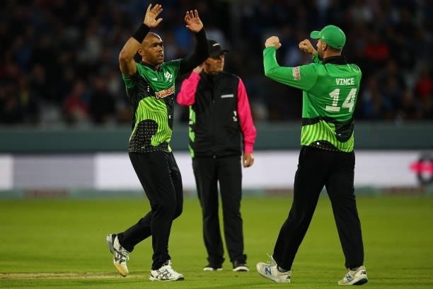 Tymal Mills of Southern Brave celebrates with team mate James Vince after dismissing Mohammed Nabi of London Spirit during The Hundred match between...