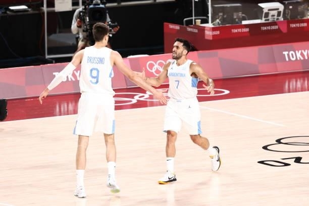 Facundo Campazzo of Team Argentina high fives his teammate, Nicolas Brussino during the game against Japan at Saitama Super Arena during the 2020...