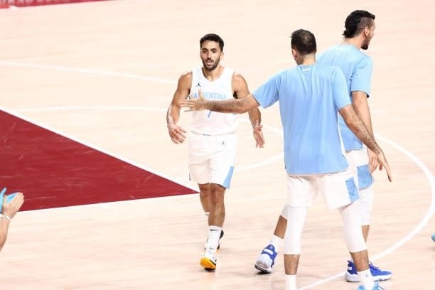 Facundo Campazzo of Team Argentina high fives his teammate during the game against Japan at Saitama Super Arena during the 2020 Tokyo Olympics on...