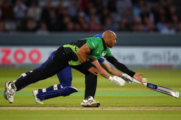 Tymal Mills of the Southern Brave attempts a run out during The Hundred match between London Spirit Men and Southern Brave Men at Lord's Cricket...