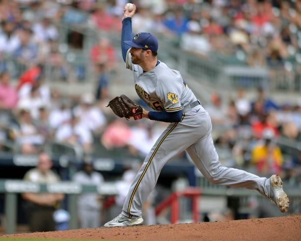John Curtiss of the Milwaukee Brewers pitches against the Atlanta Braves at Truist Park on August 1, 2021 in Atlanta, Georgia.