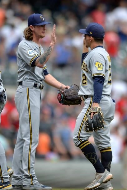 Josh Hader and Luis Urías of the Milwaukee Brewers celebrate after winning against the Atlanta Braves at Truist Park on August 1, 2021 in Atlanta,...