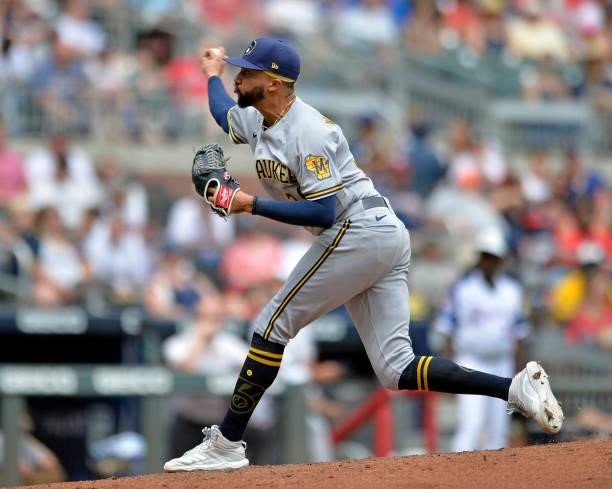 Devin Williams of the Milwaukee Brewers pitches in the eighth inning against the Atlanta Braves at Truist Park on August 1, 2021 in Atlanta, Georgia.