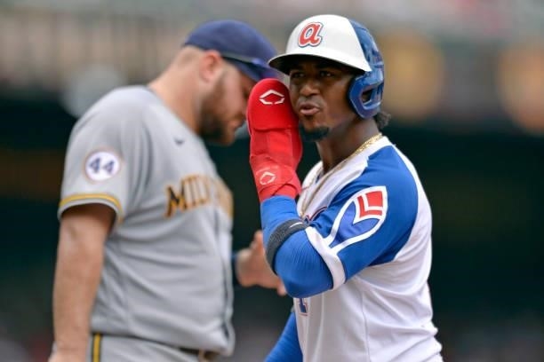 Ozzie Albies of the Atlanta Braves looks back at the dugout during a game against the Milwaukee Brewers at Truist Park on August 1, 2021 in Atlanta,...