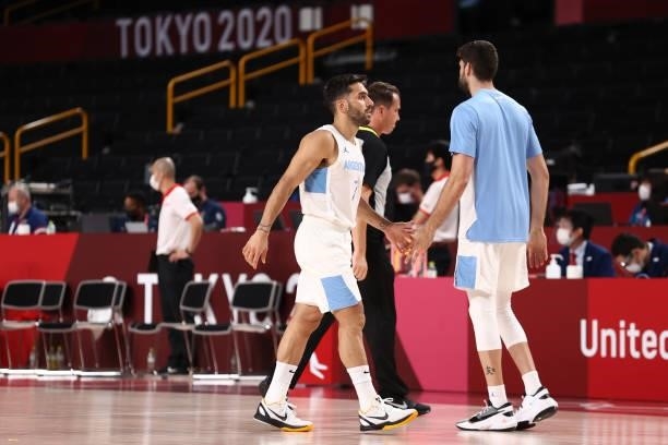 Facundo Campazzo of Team Argentina high fives his teammate during the game against Japan at Saitama Super Arena during the 2020 Tokyo Olympics on...