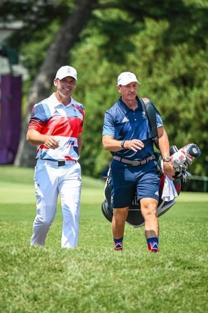 Paul Casey of Team Great Britain smiles as he walks to the first tee during the final round of Mens Individual Stroke Play Golf on day nine of the...