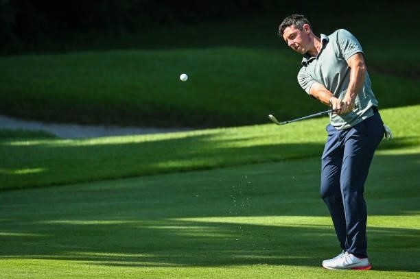 Rory McIlroy of Team Ireland chips a shot to the 17th hole green during the final round of Mens Individual Stroke Play Golf on day nine of the Tokyo...