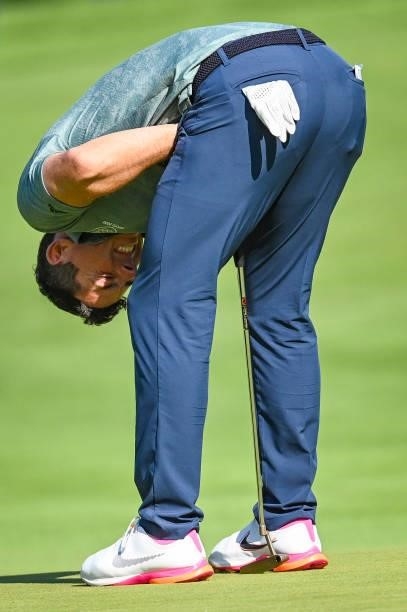 Rory McIlroy of Team Ireland reacts to missing a birdie putt on the 18th hole green during the final round of Mens Individual Stroke Play Golf on day...