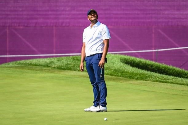 Sebastian Munoz of Team Colombia reacts to missing a birdie putt on the 16th hole green during the final round of Mens Individual Stroke Play Golf on...