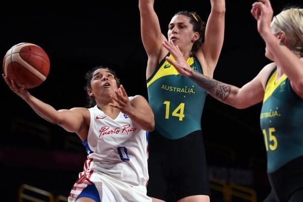 Puerto Rico's Jennifer O'neill goes to the basket past Australia's Marianna Tolo in the women's preliminary round group C basketball match between...