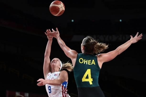 Puerto Rico's Ali Gibson takes a shot past Australia's Jenna O'hea in the women's preliminary round group C basketball match between Australia and...
