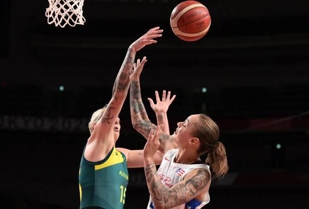 Australia's Cayla George and Puerto Rico's Jazmon Gwathmey fight for the ball in the women's preliminary round group C basketball match between...
