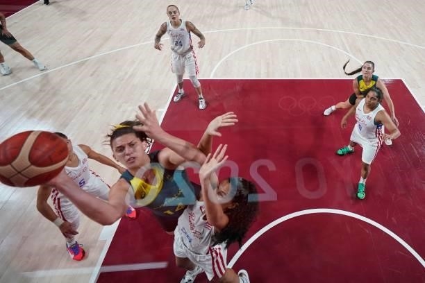 Australia's Marianna Tolo goes to the basket past Puerto Rico's Pamela Rosado in the women's preliminary round group C basketball match between...