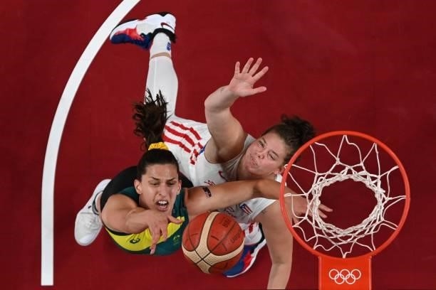 Australia's Marianna Tolo goes to the basket past Puerto Rico's Sabrina Lozada-Cabbage in the women's preliminary round group C basketball match...