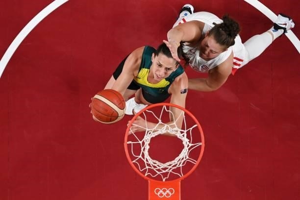 Australia's Marianna Tolo goes to the basket past Puerto Rico's Sabrina Lozada-Cabbage in the women's preliminary round group C basketball match...