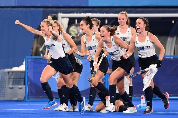 Players of Britain celebrate after defeating Spain in the penalty shoot-out after tying 2-2 in their women's quarter-final match of the Tokyo 2020...
