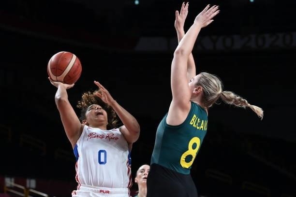 Puerto Rico's Jennifer O'neill goes to the basket past Australia's Liz Cambage in the women's preliminary round group C basketball match between...