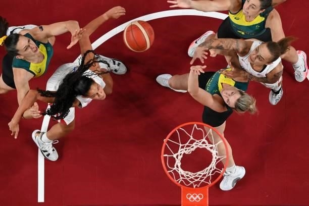 Puerto Rico's Isalys Quinones and Jazmon Gwathmey and Australia's Marianna Tolo and Jenna O'hea fight for the rebound in the women's preliminary...