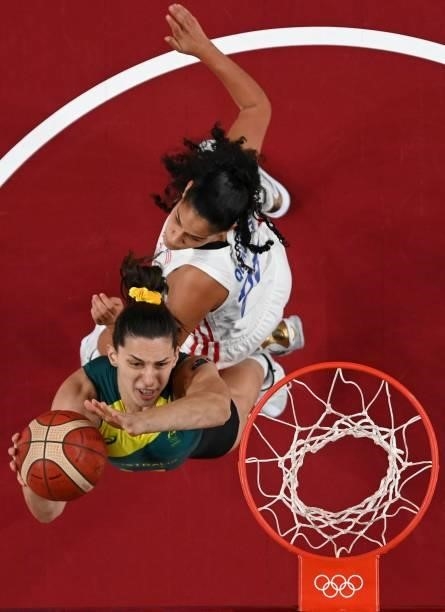 Australia's Marianna Tolo goes to the basket past Puerto Rico's Isalys Quinones in the women's preliminary round group C basketball match between...