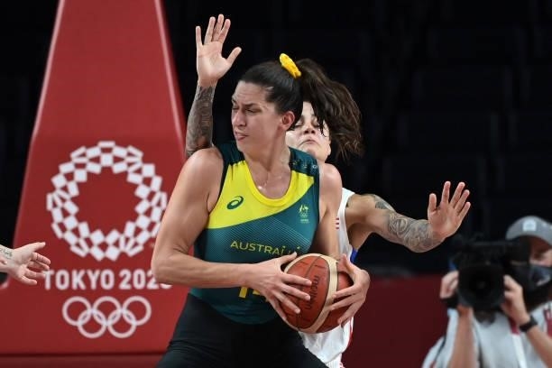 Australia's Marianna Tolo defends the ball from Puerto Rico's Jazmon Gwathmey in the women's preliminary round group C basketball match between...