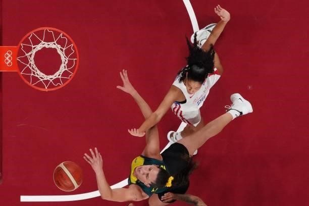 Australia's Marianna Tolo and Puerto Rico's Isalys Quinones fight for the ball in the women's preliminary round group C basketball match between...