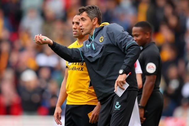 Bruno Lage the head coach / manager of Wolverhampton Wanderers talks to Marcal of Wolverhampton Wanderers during the Pre Season Friendly match...