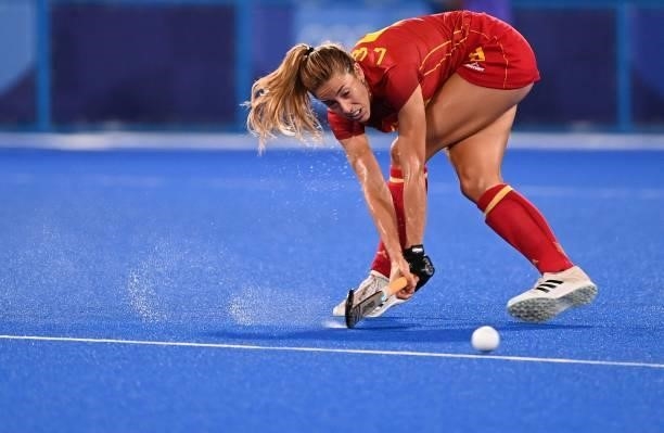 Spain's Maria Lopez strikes the ball during the women's quarter-final match of the Tokyo 2020 Olympic Games field hockey competition against Britain,...