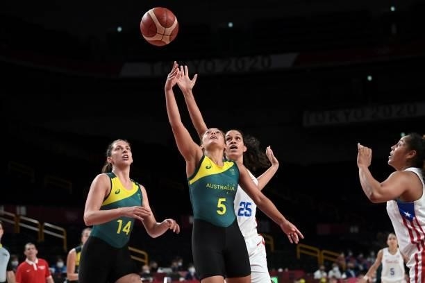 Australia's Leilani Mitchell and Puerto Rico's Isalys Quinones fight for the rebound in the women's preliminary round group C basketball match...