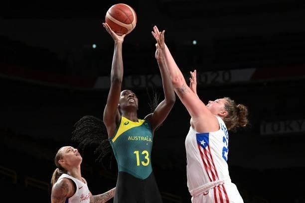 Australia's Ezi Magbegor goes to the basket past Puerto Rico's Sabrina Lozada-Cabbage in the women's preliminary round group C basketball match...