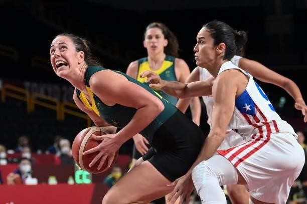 Australia's Jenna O'hea goes to the basket past Puerto Rico's Michelle Gonzalez in the women's preliminary round group C basketball match between...