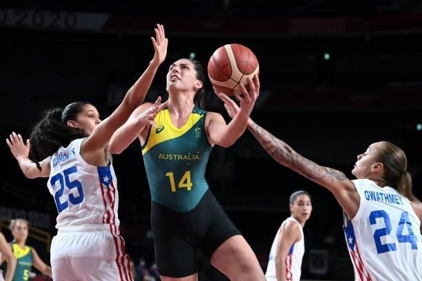 Australia's Marianna Tolo goes to the basket past Puerto Rico's Isalys Quinones and Jazmon Gwathmey in the women's preliminary round group C...