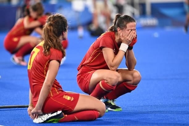 Spain's Lola Riera and Belen Iglesias react after losing the penalty shoot-out to Britain after tying 2-2 in their women's quarter-final match of the...