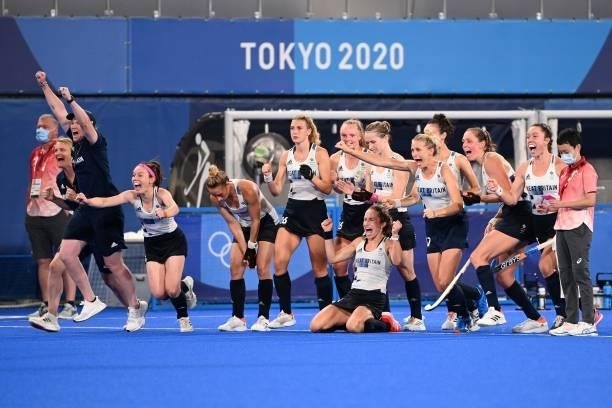 Players of Britain celebrate after defeating Spain in the penalty shoot-out after tying 2-2 in their women's quarter-final match of the Tokyo 2020...