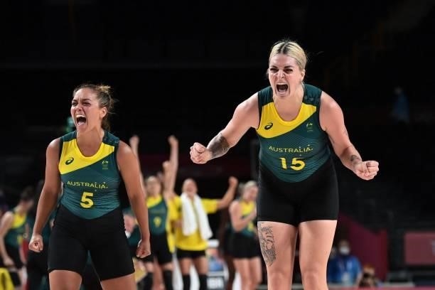 Australia's Leilani Mitchell and Cayla George celebrate their victory at the end of the women's preliminary round group C basketball match between...