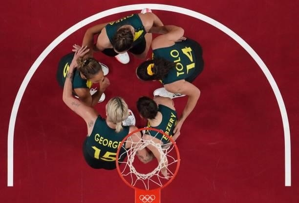 Australia's players huddle up during the women's preliminary round group C basketball match between Australia and Puerto Rico during the Tokyo 2020...
