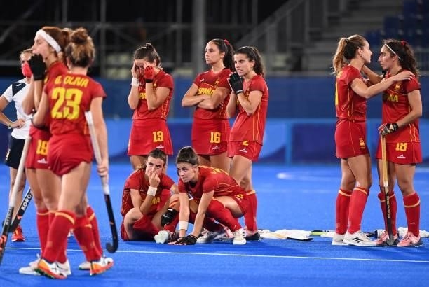 Players of Spain react after losing the penalty shoot-out to Britain after tying 2-2 in their women's quarter-final match of the Tokyo 2020 Olympic...