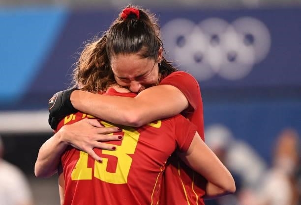 Spain's Belen Iglesias and teammate Candela Mejias embrace after losing the penalty shoot-out to Britain after tying 2-2 in their women's...